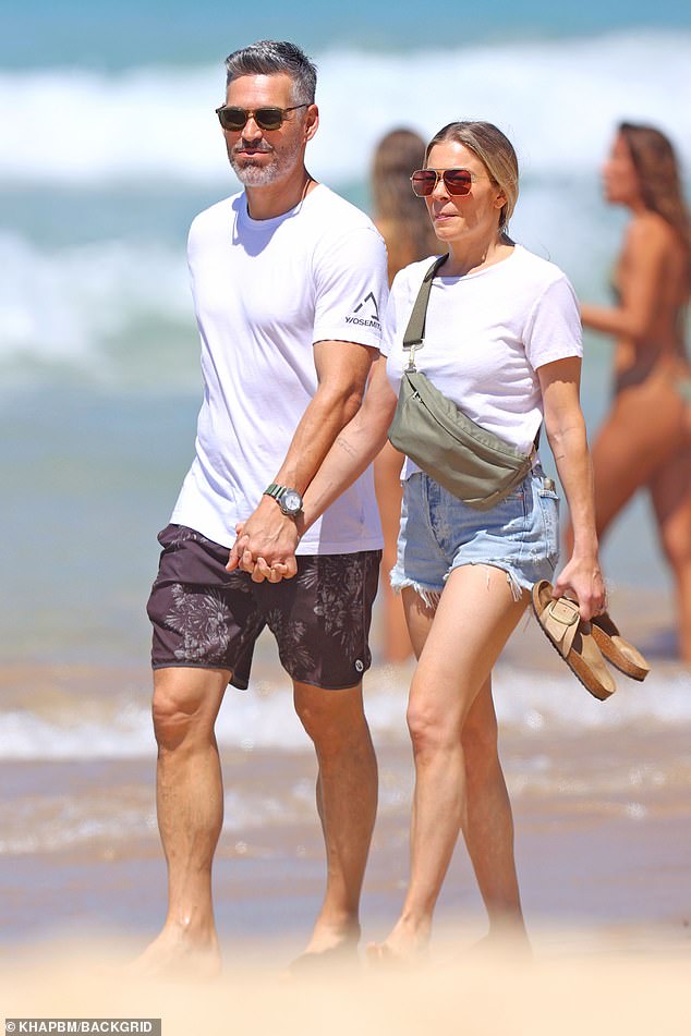 LeAnn Rimes and her husband Eddie Cibrian put on a loving show while taking a stroll on Bondi Beach in Sydney on Thursday.  Both shown