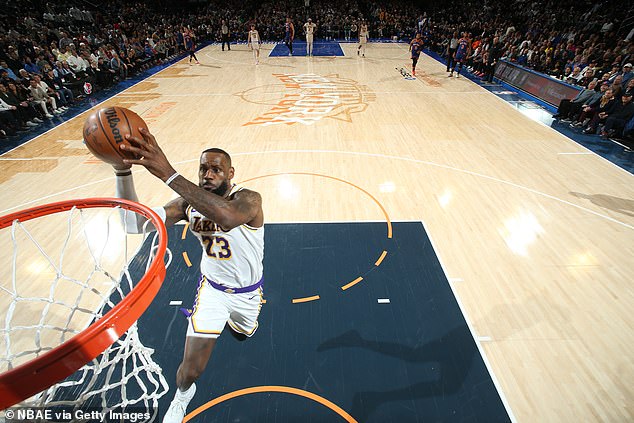 LeBron James threw down a dunk in the first quarter, while D'Angelo Russell bounced the ball off the ground to him