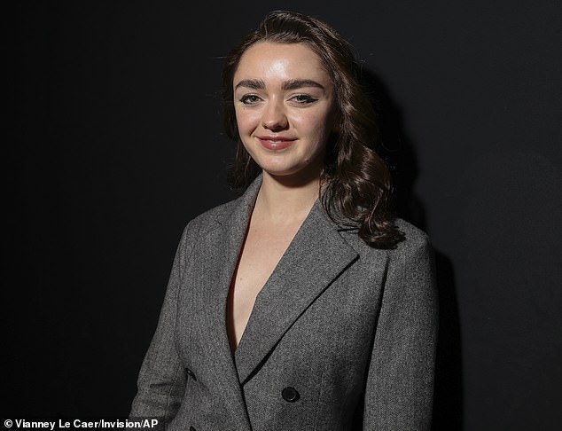 The actress stunned in the skirt suit that cinched in the waist.  She paired it with black tights and black platform heels