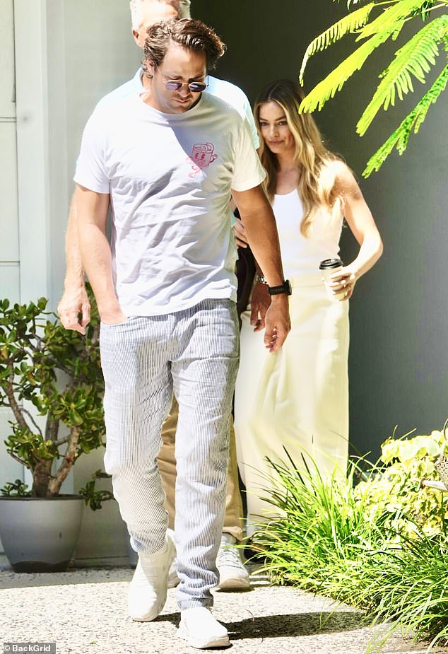 Margot Robbie seemed every bit the loving daughter on Saturday afternoon.  The Barbie star, 33, who was in Australia for the AACTA Awards ceremony in Queensland, couldn't wipe the smile off her face as she visited her mother Sarie Kessler's estate on the Gold Coast.