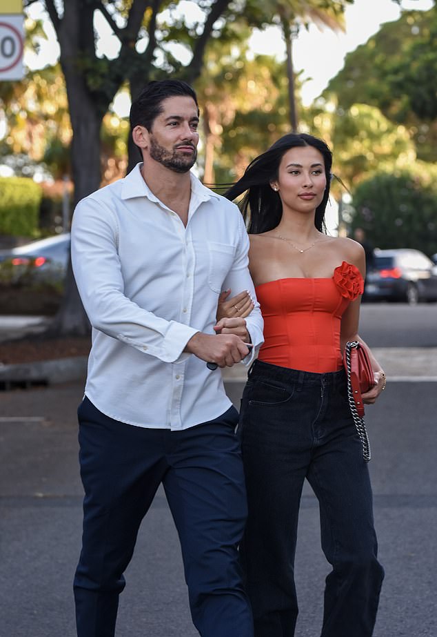 The outfit was completed with a pair of crisp white sneakers and a matching red Chanel handbag, for a touch of designer flair