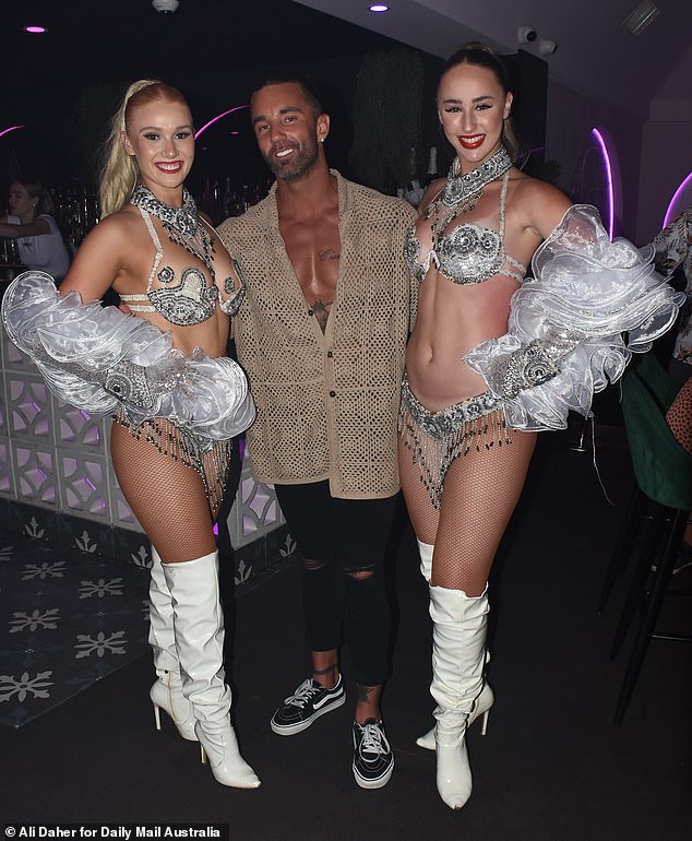 Married At First Sight groom Jack Dunkley, 34, (centre, with two scantily clad guests) celebrated up a storm at Maxim Australia's Valentine's Day party on the Gold Coast on Sunday.