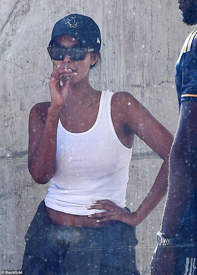 Maya Jama, 29, was spotted puffing on a suspicious-looking sandwich outside Cape Town International Airport with her boyfriend Stormzy this week