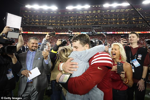 Purdy hugs Brandt after beating the Lions 34-31 in the NFC Championship Game