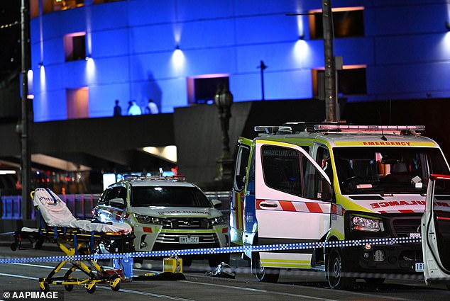 Police were justified in shooting a man on Melbourne's Princes Bridge on Friday after saying he was a threat to officers (depicted scene of incident with emergency services)