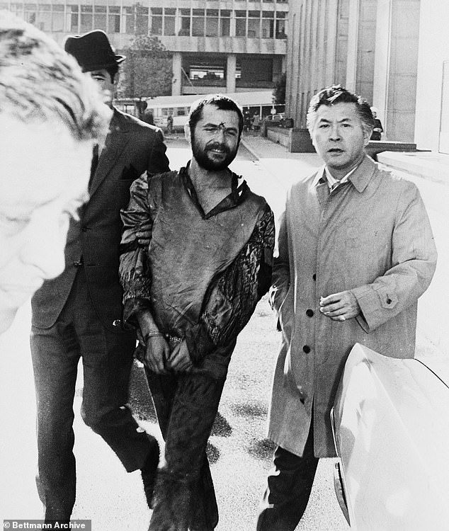 The parole hearing of Bruce Davis, now 81, a member of Charles Manson's murderous cult, has been postponed after he appeared on a true crime podcast.  Pictured: Davis (left) with his attorney outside the Hall of Justice in 1969 after his arrest