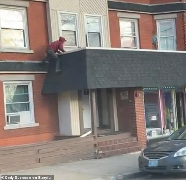 The anonymous man rushed to the toddler after trying to tell the child to step back from the edge of the building