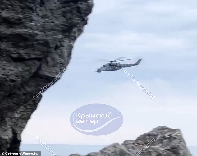 Two Russian Mi-8 helicopters were seen today flying to and from the scene of the landing ship attack in an apparently desperate rescue operation on calm seas.