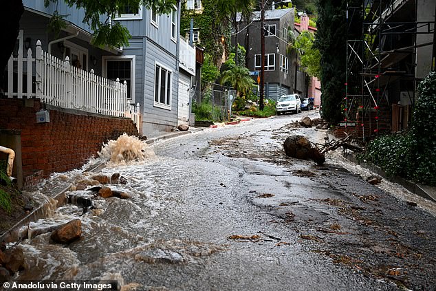 Roads have been flooded with mudslides and brown water in parts of the Sunshine State, including the Beverly Crest neighborhood (pictured)