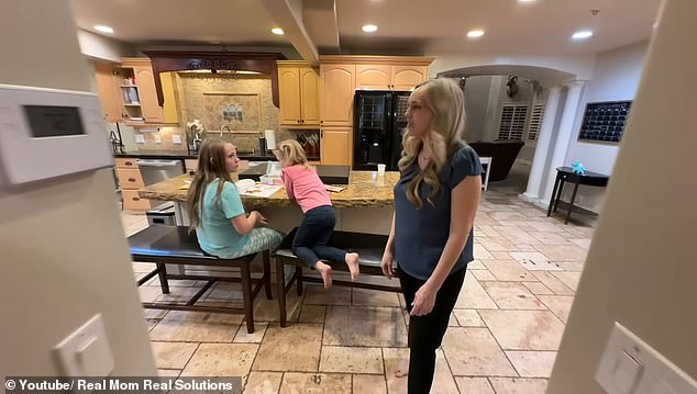 Nancy Young, who lives in the US, also has seven grandchildren, while twelve of her children still live at home.  She is pictured here in the kitchen