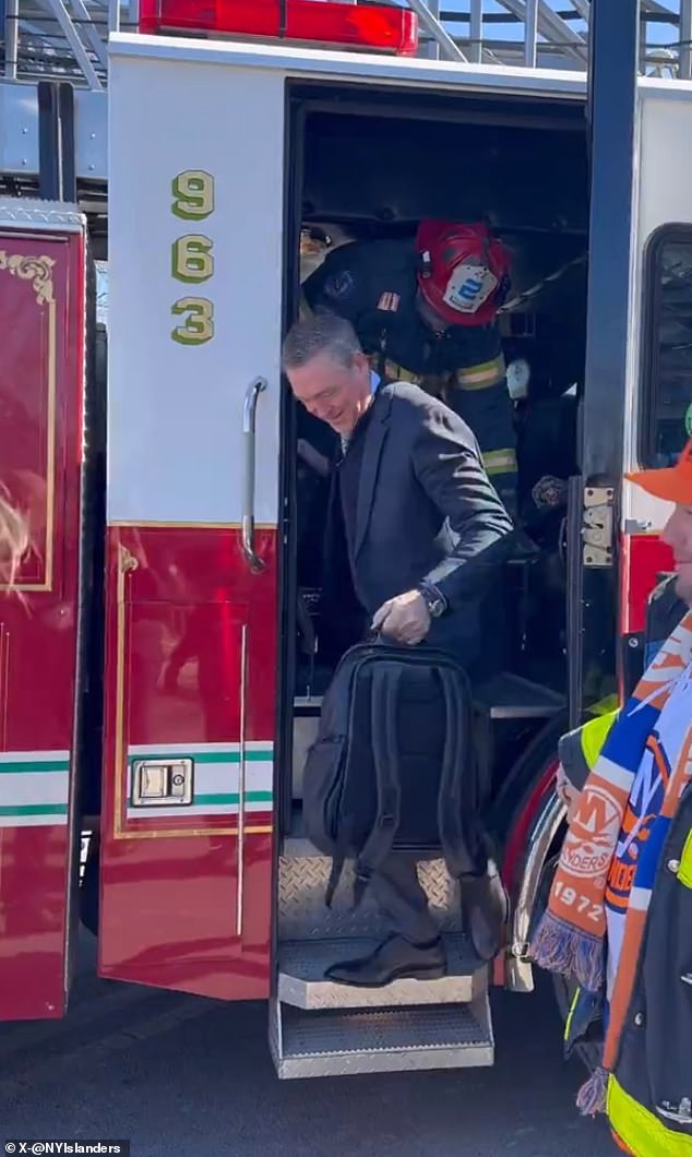 Islanders coach Patrick Roy leaves a fire truck en route to MetLife Stadium on Sunday