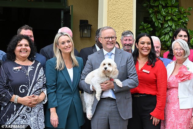 A Newspoll has revealed what Australians really think about changes to the phase three tax cuts (pictured Anthony Albanese with partner Jodie Haydon)