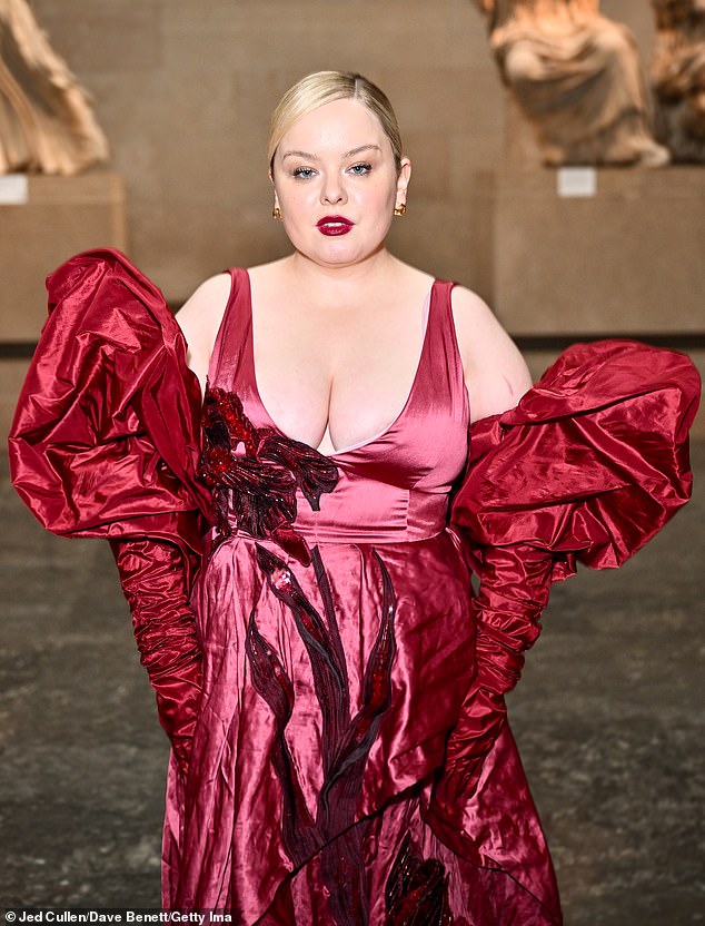 Bridgerton star Nicola, 37, made a fashion statement as she arrived at the British Museum in a red maxi dress