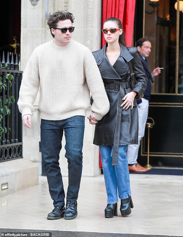 She completed the look with a Fendi handbag slung over her shoulder and angular orange sunglasses