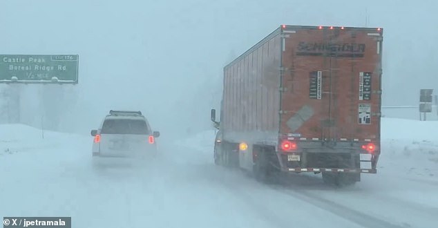 Heavy rain flooded California roads and much-needed snow piled up in the mountains as the first of successive atmospheric rivers lashed the state on Thursday.  In the photo: the roads at the Donner Pass in the Sierra Nevada