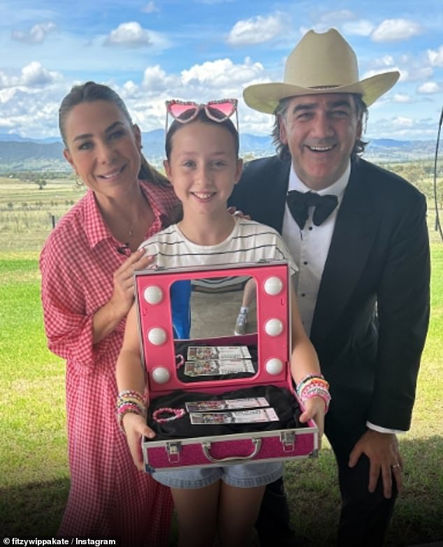 Nova's Fitzy and Wippa with Kate Ritchie brought a 10-year-old Swiftie to tears on Friday morning after surprising her with two tickets to Taylor Swift's concert in Sydney: Pictured: Presenters Kate Ritchie and Michael 'Wippa' Wipfli with young Olivia