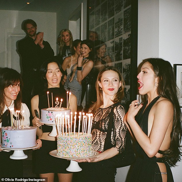 Olivia Rodrigo (R) threw herself a star-studded birthday party in the hours before she officially turned 21 and became a legal adult in the United States on Tuesday