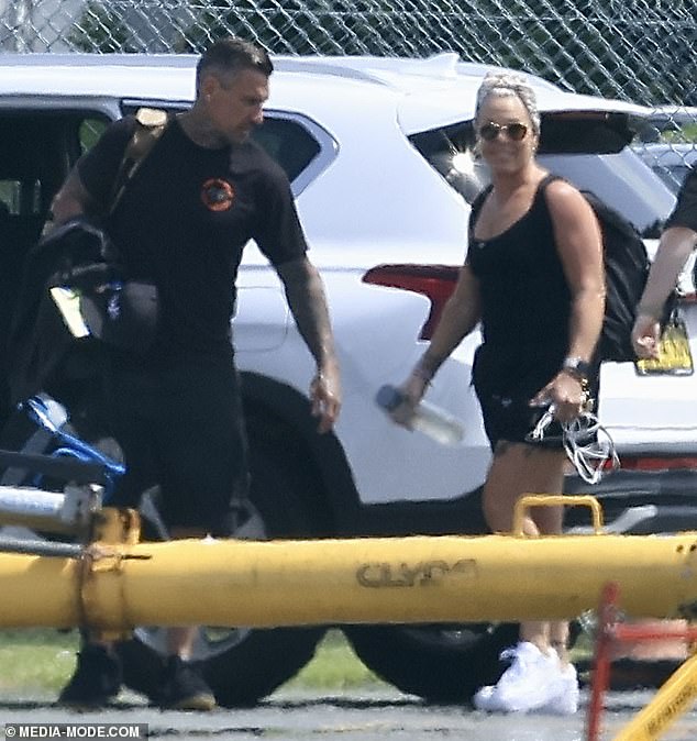 Pink was spotted flying from Queensland on Wednesday.  Pictured with husband Carey Hart