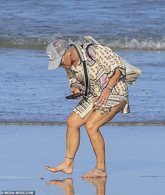 Pink and her family had an encounter with some bluebottles that had washed up on a beach in Queensland on Thursday