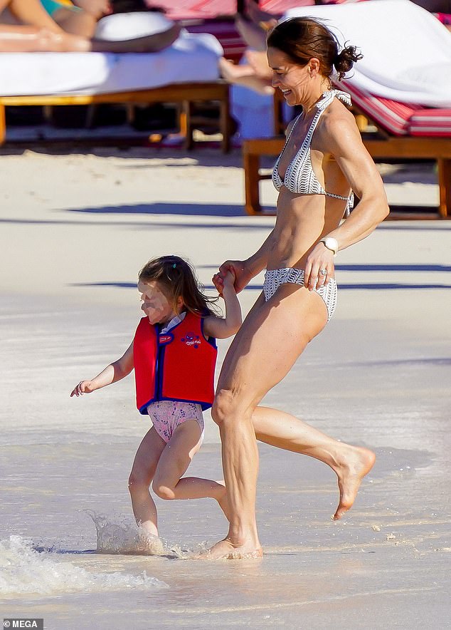 In the photo: Pippa Middleton was seen running to the water with her eldest daughter Grace earlier this month