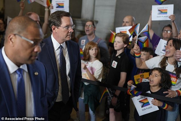 The Republican-led Tennessee House has passed a bill that would ban the display of pride flags in classrooms.  Speaker of the House of Representatives Cameron Sexton walks past protesters