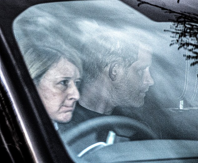 Prince Harry is seen in the car as he arrives at Clarence House to meet his father, King Charles