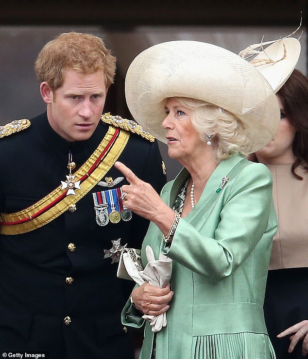 Camilla speaks with Prince Harry at Buckingham Palace during Trooping the Color in June 2015