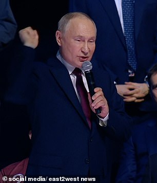 Vladimir Putin was accused today of making a 'gesture reminiscent of a Nazi salute'