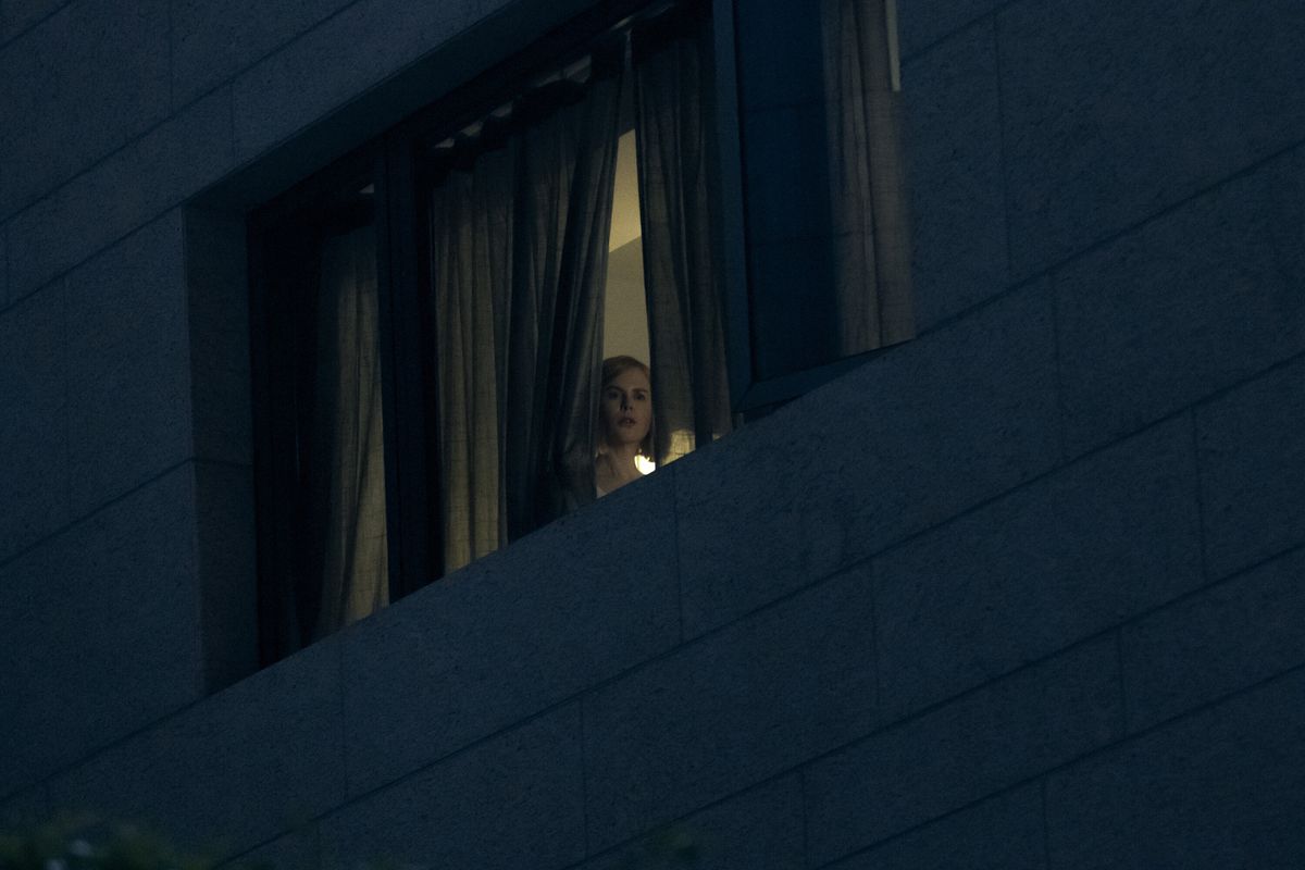 Margaret (Nicole Kidman) peers out a window 