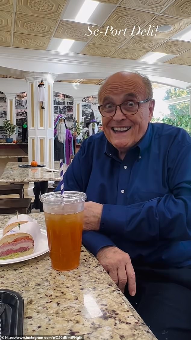 In the video, Giuliani holds the plastic plate with the dogwood on it – a ham, roast beef and turkey sandwich – while making several dazzling facial expressions.