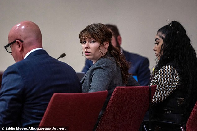 The jury at the manslaughter trial of Rust gun guard Hannah Gutierrez-Reed (pictured center) was shown a photo of the ammunition cart used on the set where Alec Baldwin killed cameraman Halyna Hutchins.