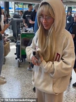 When she arrived at Melbourne Airport, she was greeted by fans who filmed her arrival.  But one detail in the video shared to the social media platform sent fans wild: the Harvard hoodie Sabrina wore belongs to boyfriend Barry Keoghan
