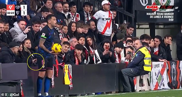 A Rayo Vallecano fan appeared to poke Lucas Ocampo in the back on Monday evening