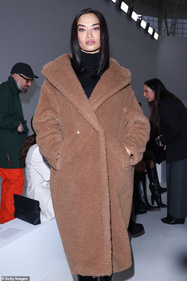 Shanina Shaik (pictured) looked very stylish as she posed for the cameras at the Max Mara fashion show during the Max Mara Womenswear Fall/Winter show during Milan Fashion Week