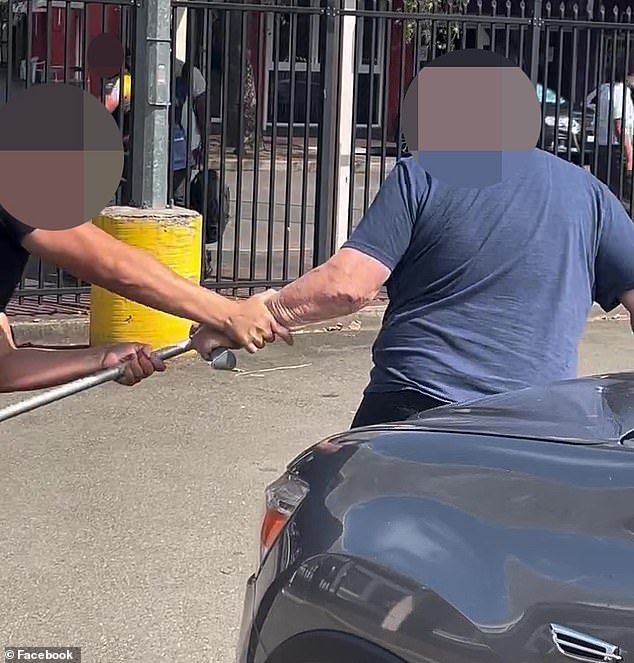 A teenage fighter steals an elderly man's walking crutch to use as a weapon during a wild fight in Sydney's south-west