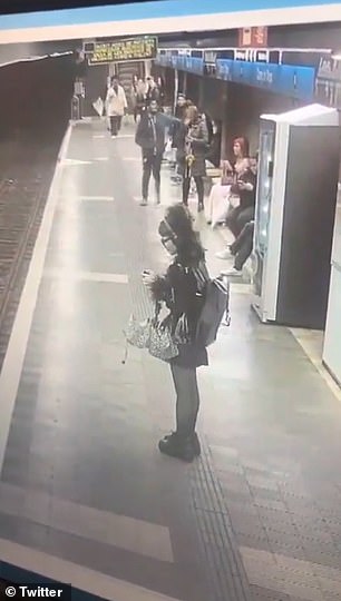 The man can be seen walking across the platform and lashing out at several women before punching one woman to the ground