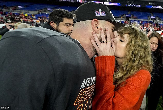 The couple shared a kiss on the field after the Kansas City Chiefs defeated the Baltimore Ravens