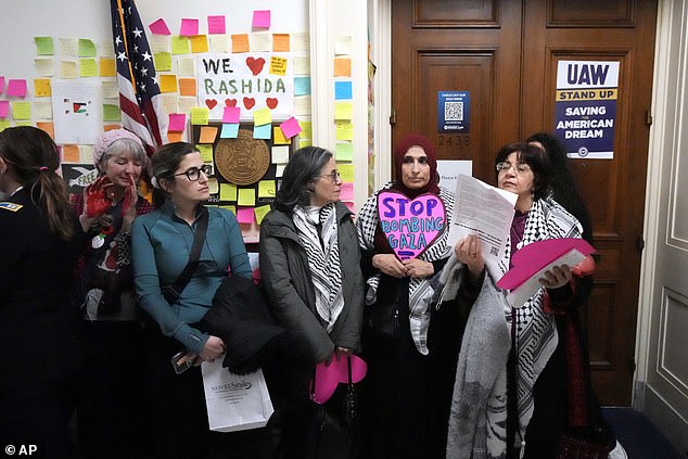 Activists from the group CODEPINK stand outside the offices of Rep. Rashida Tlaib, D-Mich., on Thursday as they advocate for Gaza on Capitol Hill