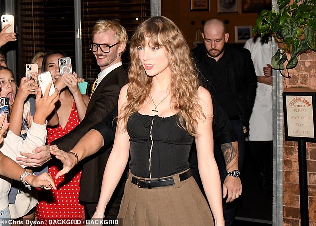 Taylor Swift (pictured) stunned fans when she changed up her signature look while dining out in Sydney's chic suburb of Surry Hills on Tuesday