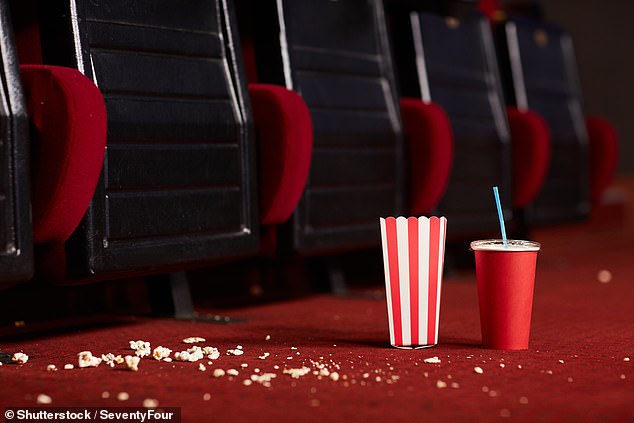 With rain forecast for much of Britain this weekend, many Britons are planning a fun trip to the cinema.  But a new study might encourage you to carry some disinfectant spray along with your snacks (stock image)