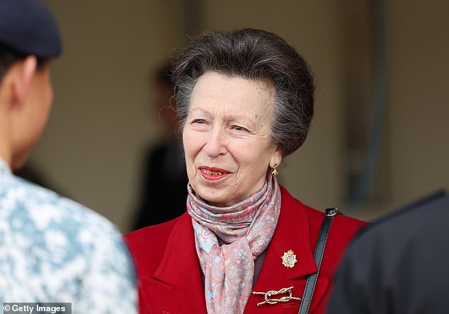 Princess Anne smiles as she speaks to military personnel during her visit to the Defense Explosive Ordnance Disposal Training Regiment at St. George's Barracks today