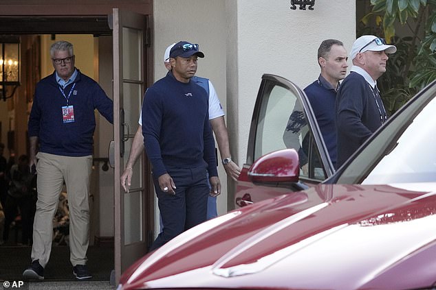 Tiger Woods gets into a car on Friday after undergoing IV treatment