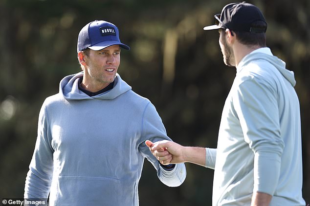 NFL legend Tom Brady and Bills QB Josh Allen bumped fists while playing golf