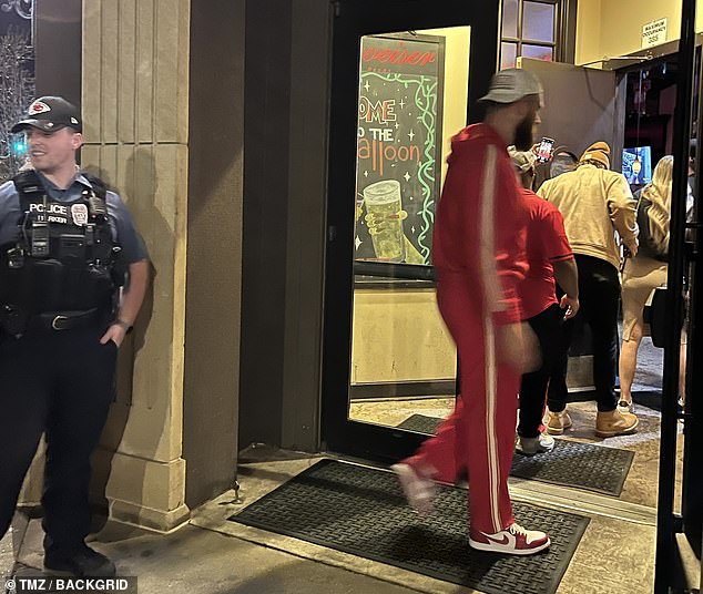 Kelce clutched a beer as he entered the Granfalloon Restaurant and Bar in Kansas City
