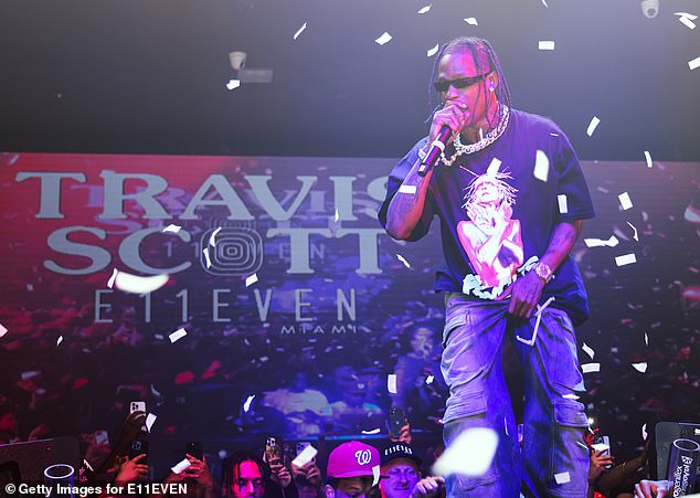 A couple was spotted hot and heavy in a Las Vegas hotel room overlooking Travis Scott's concert on Saturday night;  Scott photographed a performance at E11EVEN Miami last year