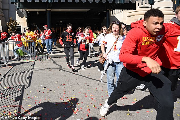 People flee after shots are fired near the Kansas City Chiefs' Super Bowl LVIII victory parade on February 14, 2024 in Kansas City, Missouri
