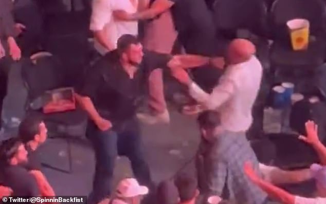 The incident escalated when one fan was floored by a viscous left hook from the other