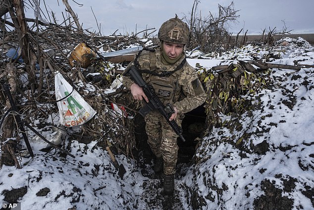 A Ukrainian soldier takes his position on the front line near Klishchiivka, Donetsk region, Ukraine, Friday, February 19, 2024