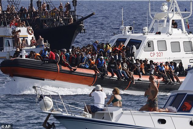 According to the Ministry of the Interior, Italy saw a 50 percent increase in the number of illegal migrant landings last year compared to 2022. Pictured: An Italian Coast Guard boat transports migrants near the port of the Sicilian island of Lampedusa, southern Italy, on September 18, 2023