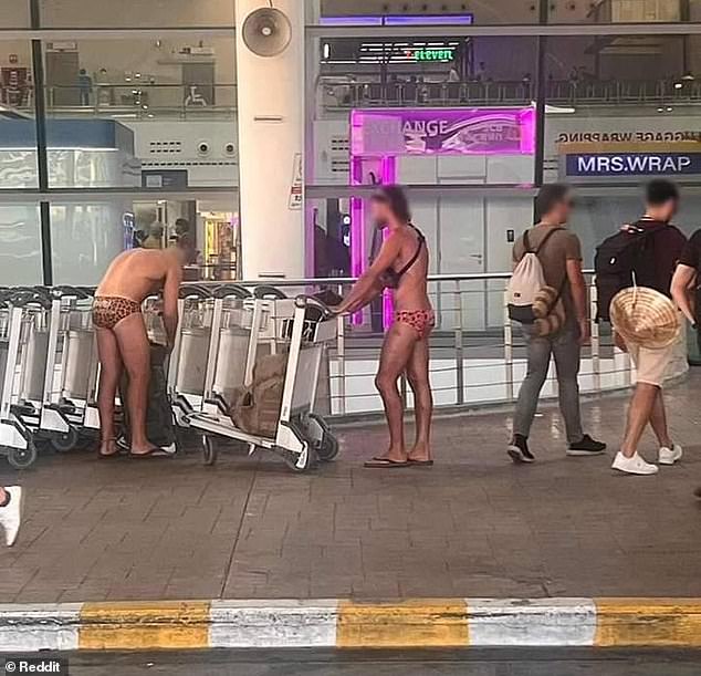 The image, taken at Phukey Airport, showed the two men loading trolleys with bags